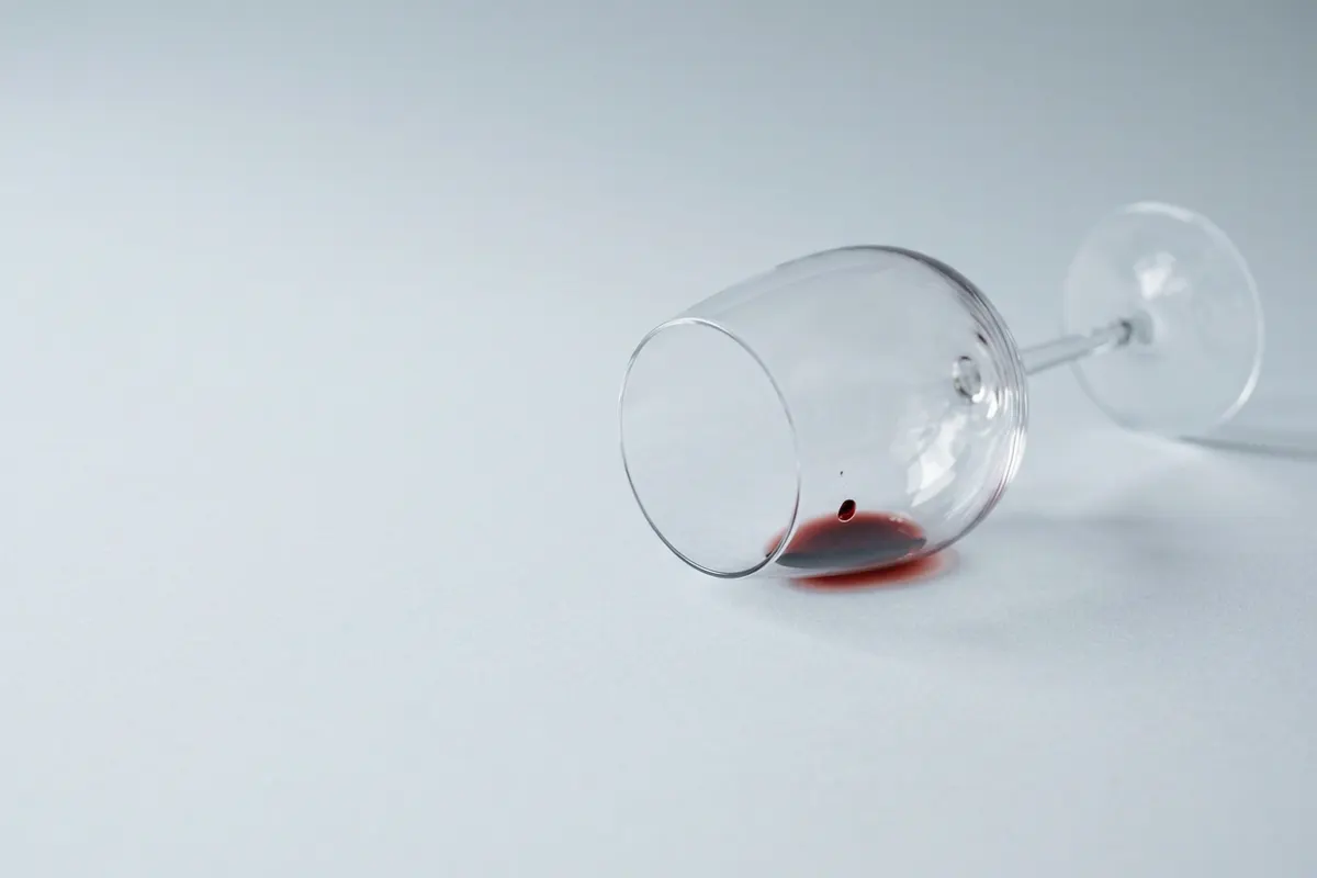 An empty wine glass on its side