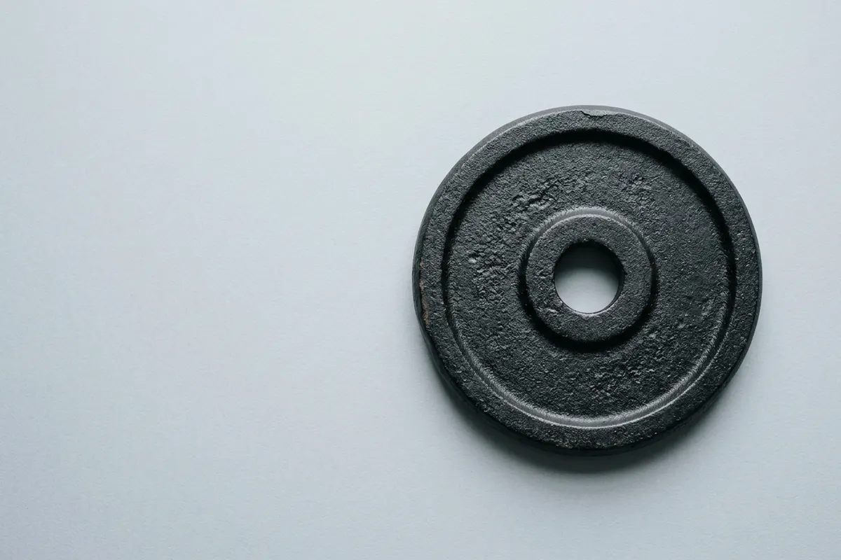 A cast-iron weight plate lying flat