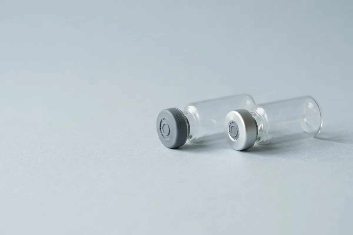 Two unlabeled glass injection vials