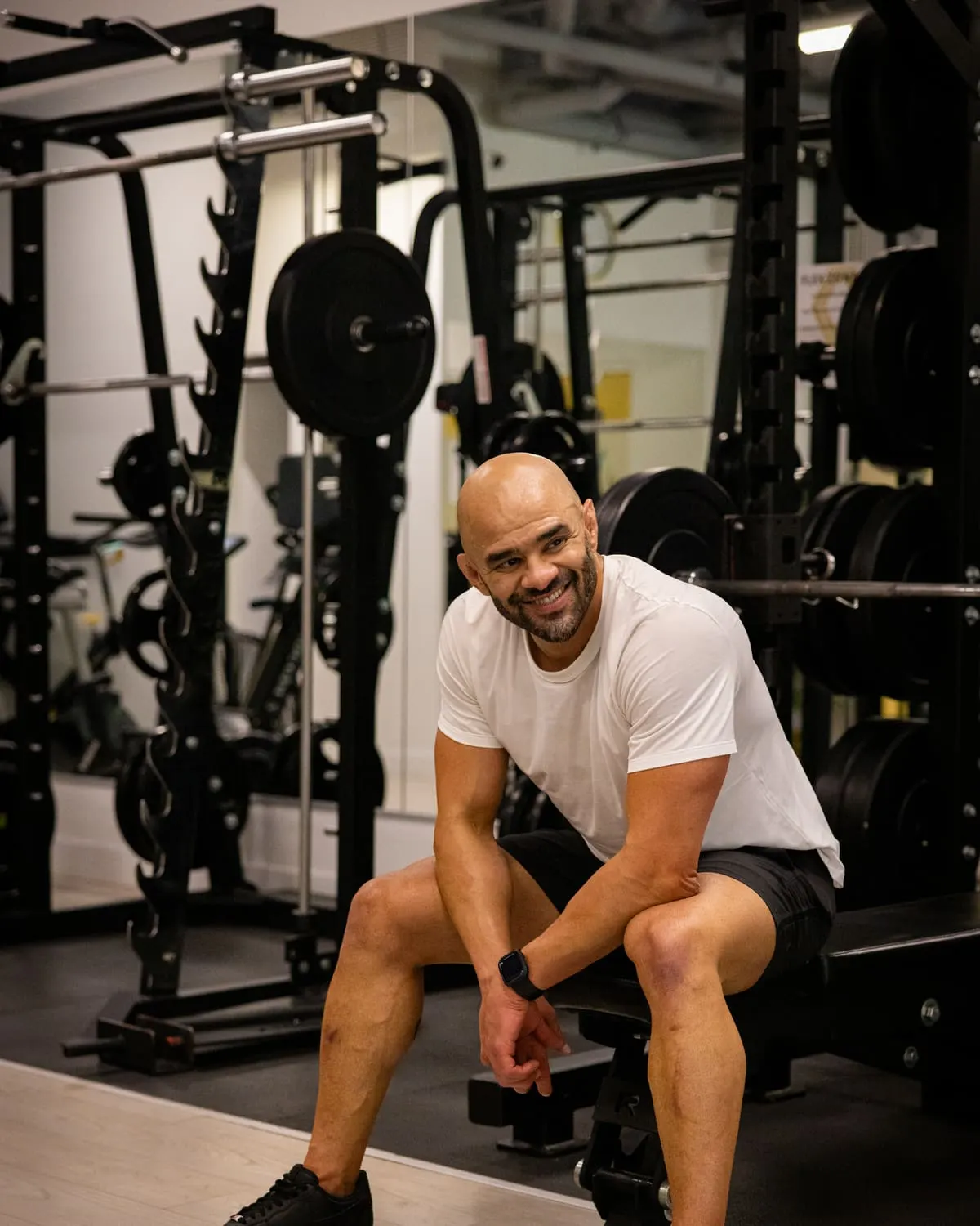 JD Botezelli PhD seated on a bench in the gym